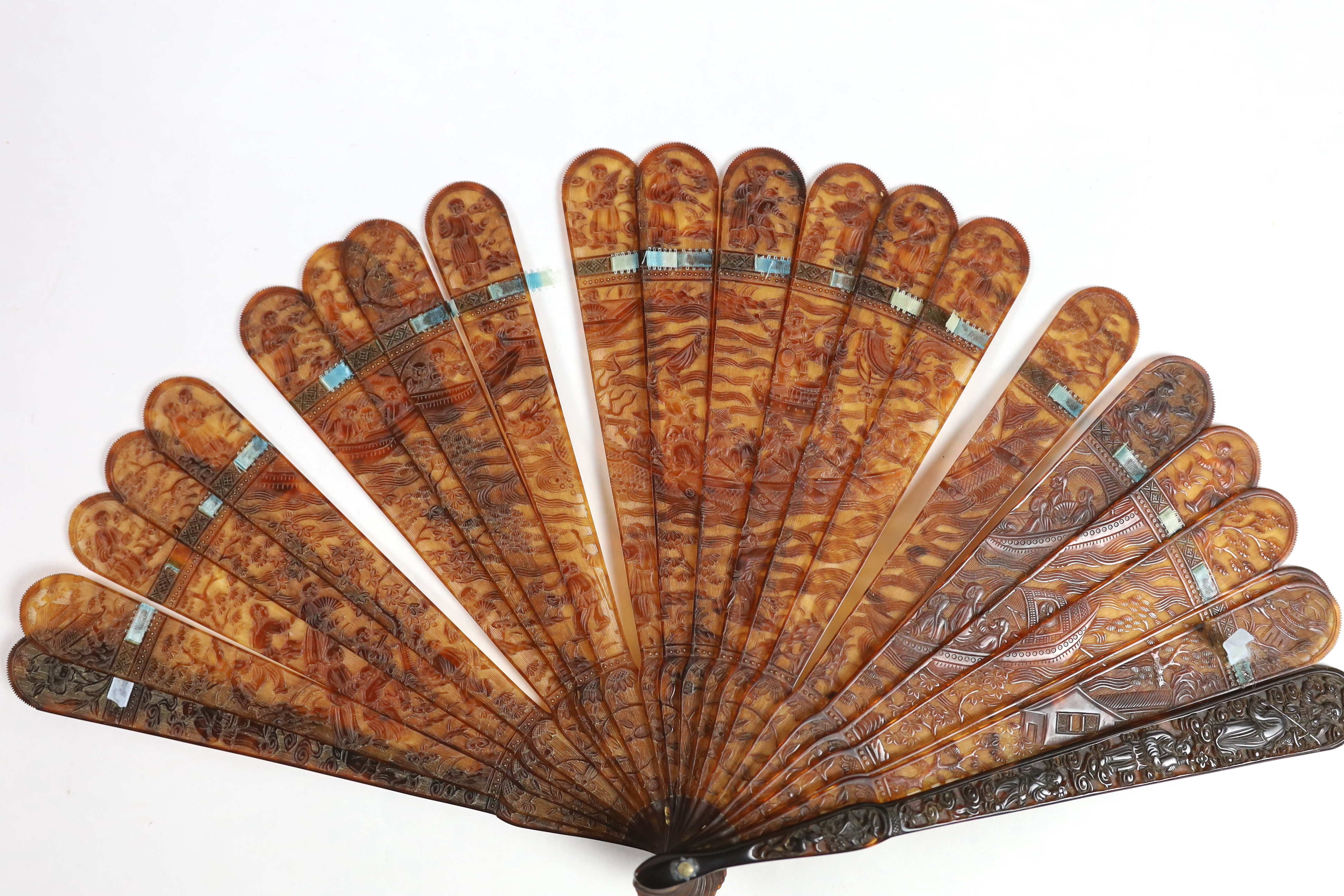 A 19th century Chinese finely carved tortoiseshell brisé fan, 18cm high